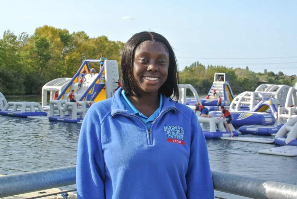 Headshot of Abi with aquapark in background